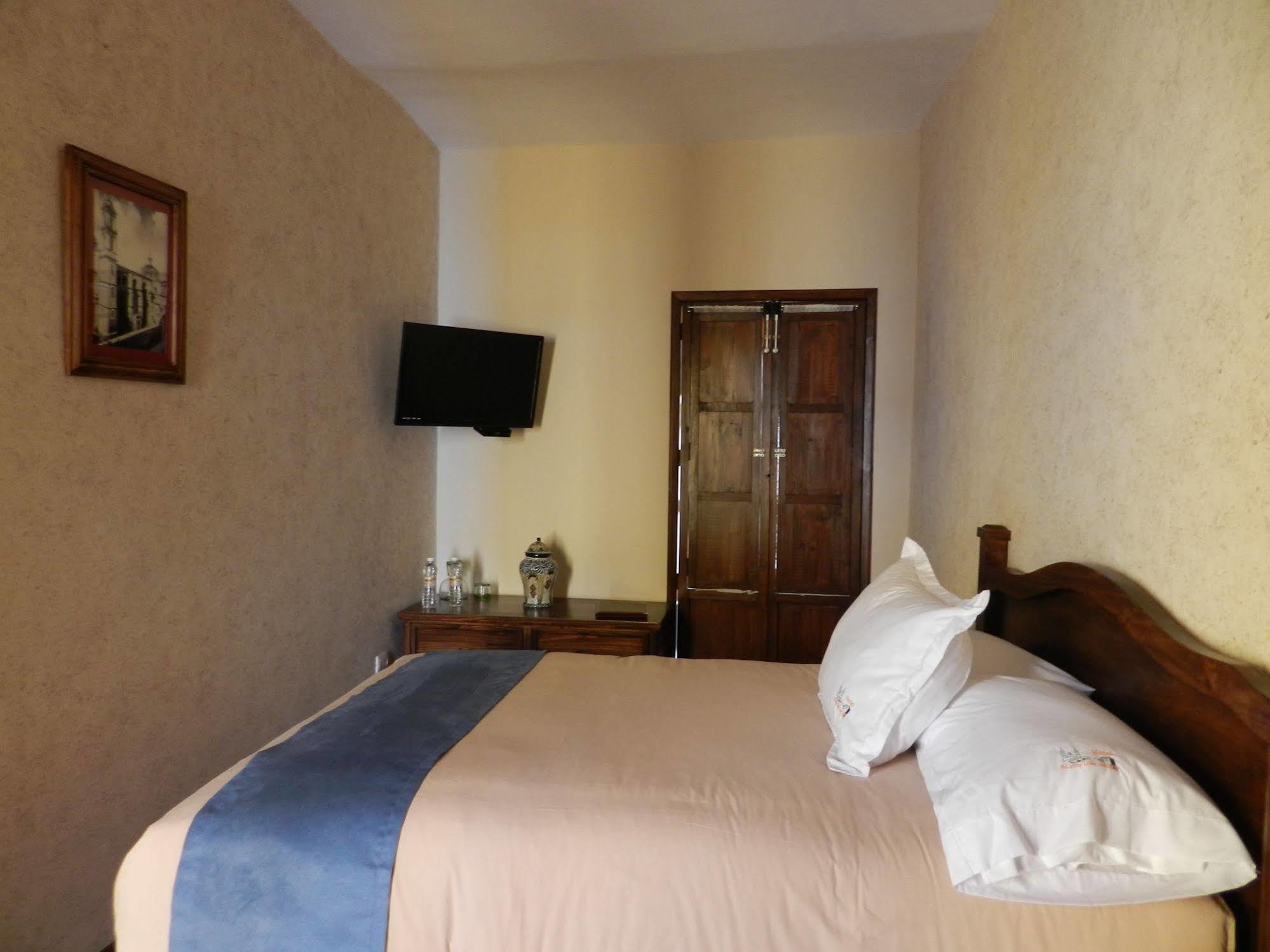 ホテル Collection O Al Otro Lado Del Rio, プエブラ エクステリア 写真 A room at the hotel