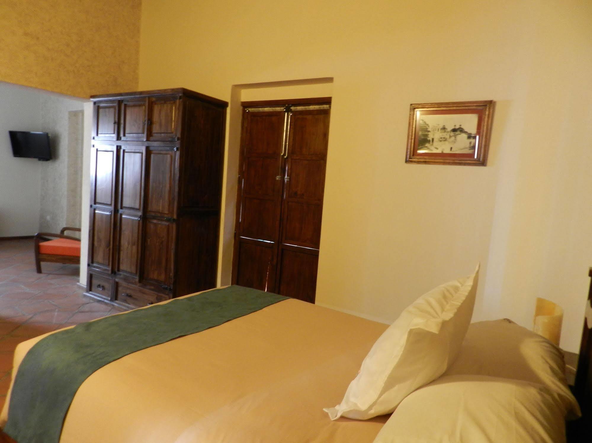 ホテル Collection O Al Otro Lado Del Rio, プエブラ エクステリア 写真 A room at the hotel